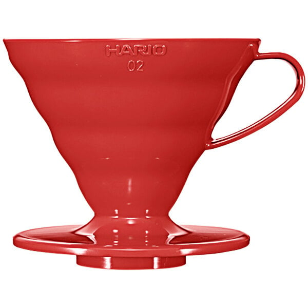 A red plastic Hario V60 coffee dripper with a handle.