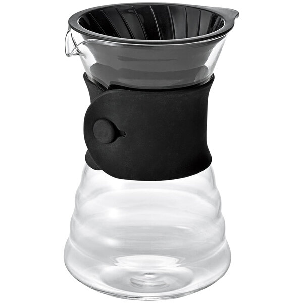 A clear glass coffee pot with a black rubber band around the middle.