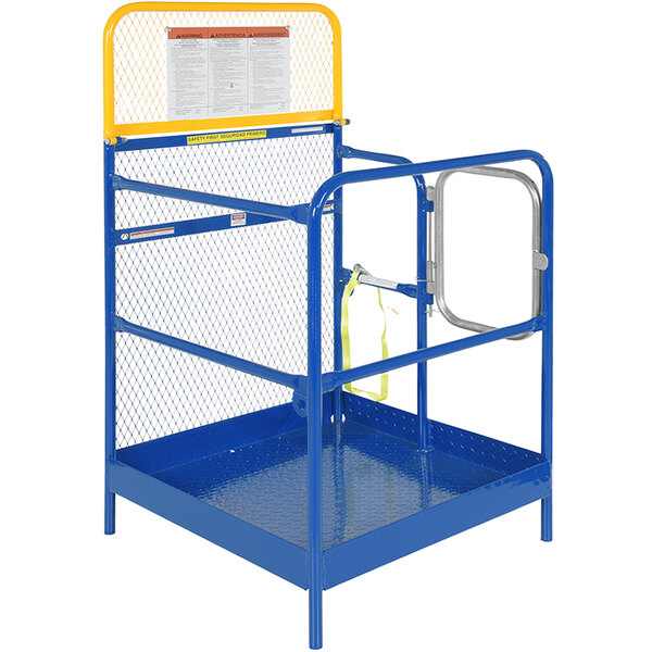 A blue and yellow metal platform with safety rails and a gate.