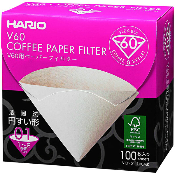 A box of 100 Hario V60 natural paper coffee filters with white paper in a triangle shape.