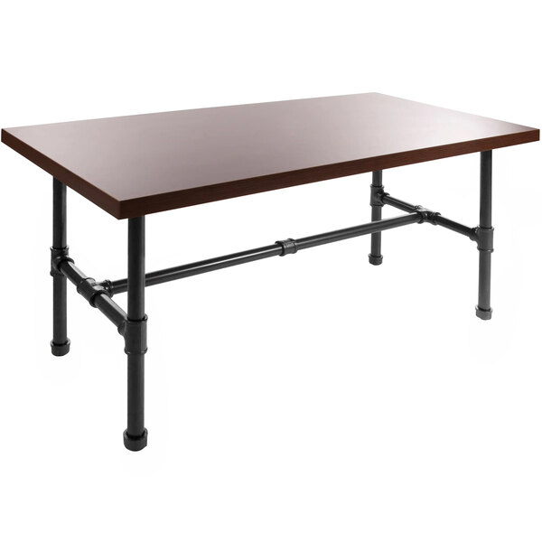 An Econoco nesting table with a woodgrain top and black pipe legs.