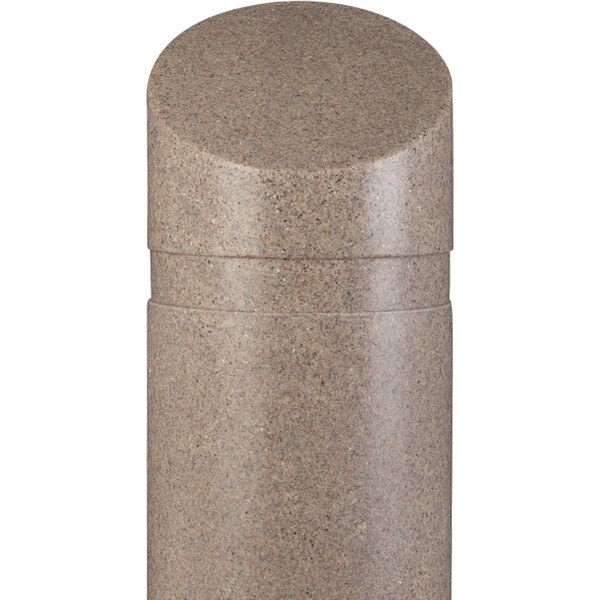 A tan granite cylindrical cover with a slanted top on a counter.