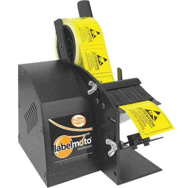 A close-up of a black and yellow Start International LD3000 label dispenser with a yellow label on it.