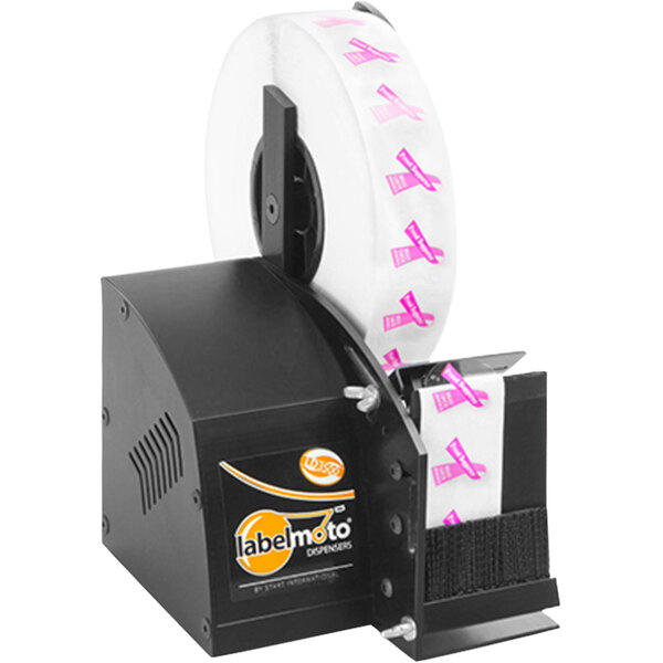 A black Start International LD3500 label dispenser with a roll of white labels with a pink logo on it.