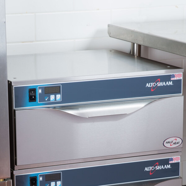 An Alto-Shaam 1 Drawer Warmer on a stainless steel counter.