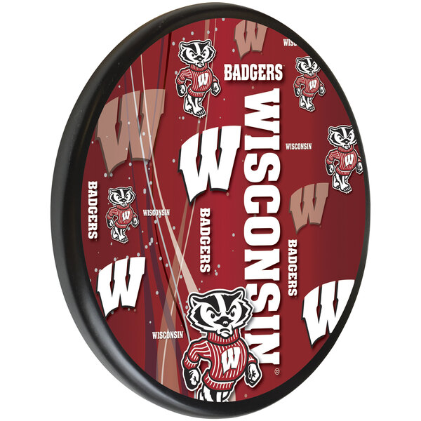 A round red wooden sign with "University of Wisconsin" and a white "W" logo.