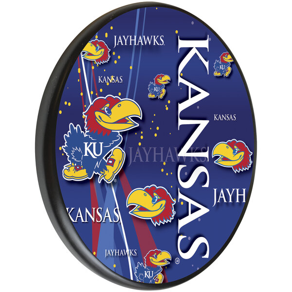 A blue oval wooden sign with a red and blue University of Kansas Jayhawks logo and white text.