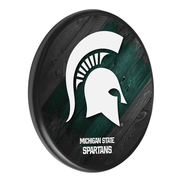 A white wooden sign with the Michigan State Spartans logo.