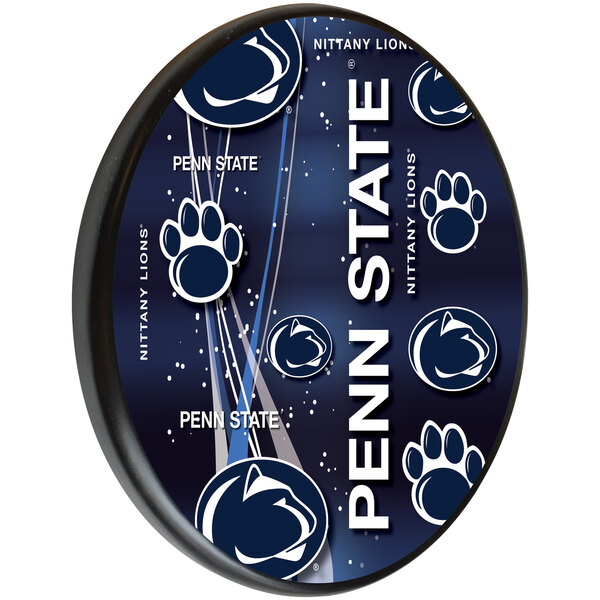 A blue and white wooden sign with a Penn State paw print logo.