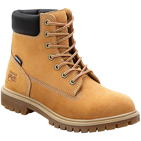 A brown Timberland PRO steel toe boot with black laces.