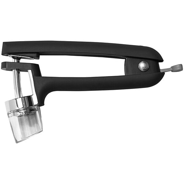 A black and silver hand held OXO cherry and olive pitter.