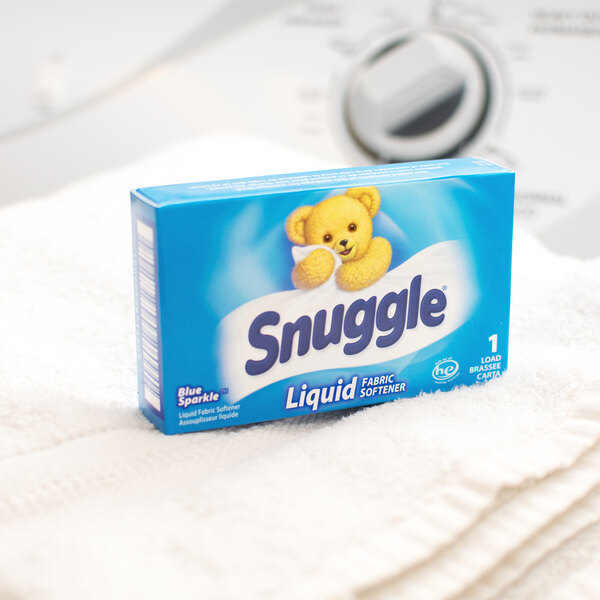 A blue box of Snuggle liquid fabric softener on a counter.