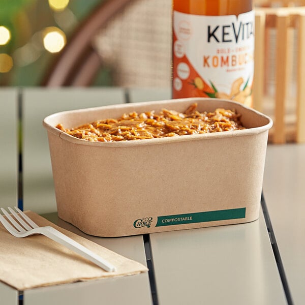 A rectangular EcoChoice paper take-out container of food on a table.