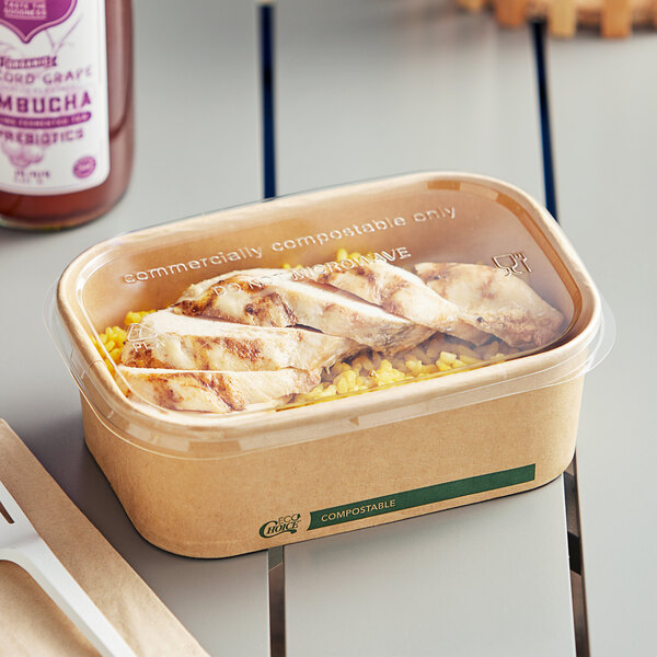 A chicken and rice take-out meal in an EcoChoice compostable PLA lid.