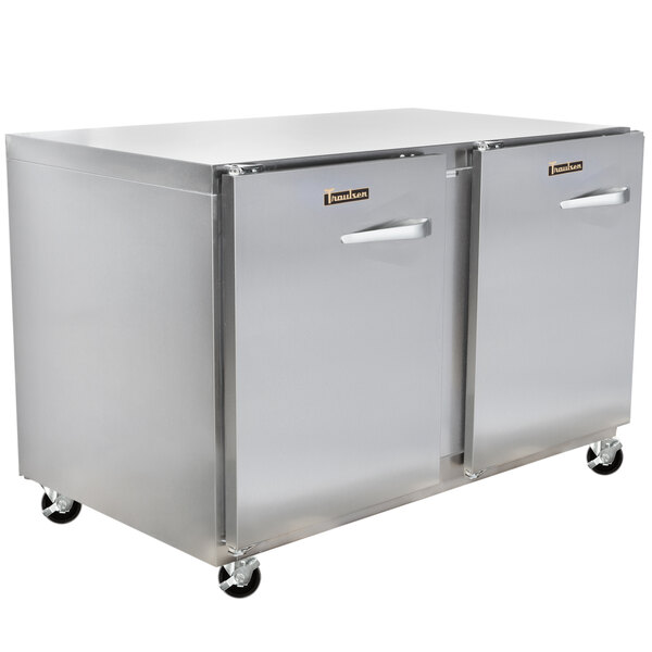 Two Traulsen stainless steel undercounter refrigerators on wheels.