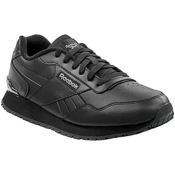 A black Reebok shoe with a white background.