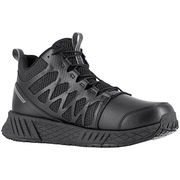 A Reebok Work black mid-high athletic shoe with composite toe and non-slip sole.