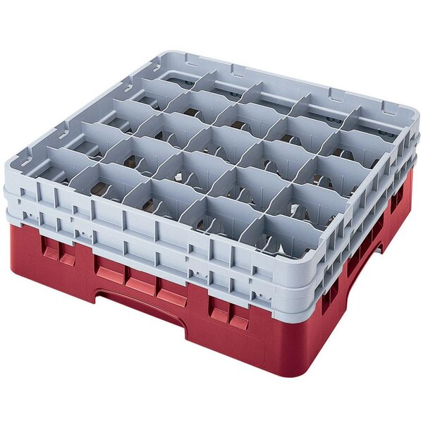 A red plastic Cambro glass rack with white trays and extenders.