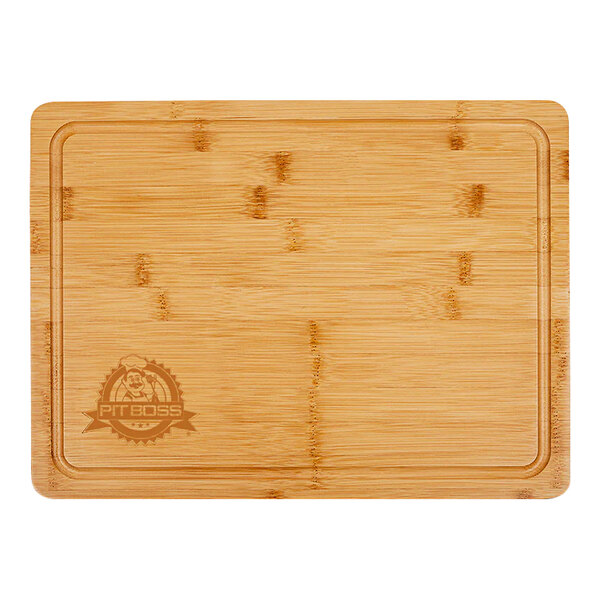 A Pit Boss wooden cutting board with a logo on it.