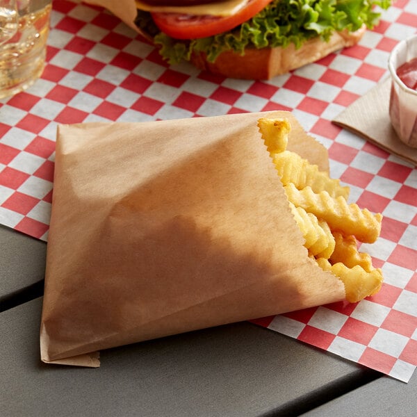 A bag of fries on a table.