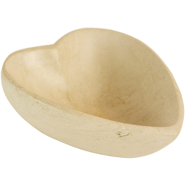 A white heart-shaped stone display bowl.