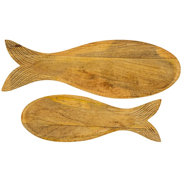 A set of two wooden fish shaped serving trays.