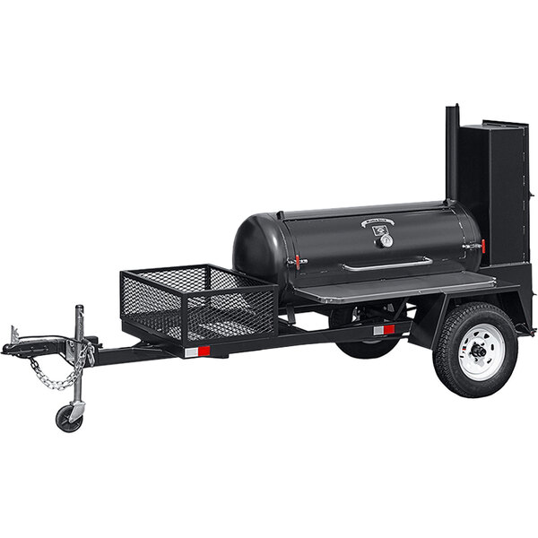 A black barbecue smoker on a trailer.