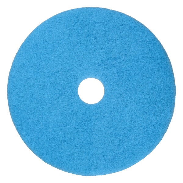A blue Scrubble burnishing pad with a white center hole.