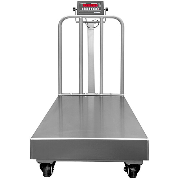 An Optima Weighing Systems stainless steel receiving scale on wheels with a digital display.