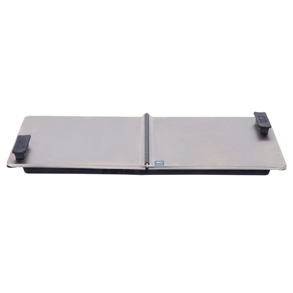 A rectangular stainless steel lid with black handles.