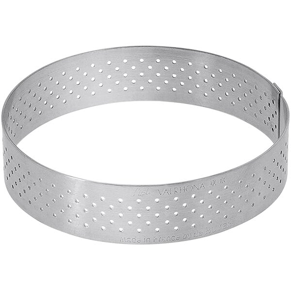 A silver stainless steel de Buyer tart ring with holes.