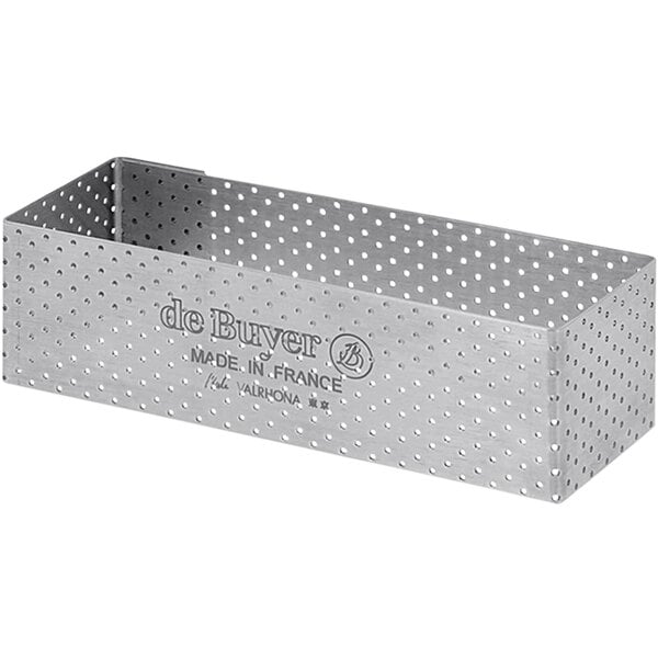 A de Buyer stainless steel rectangular tart ring with perforations.