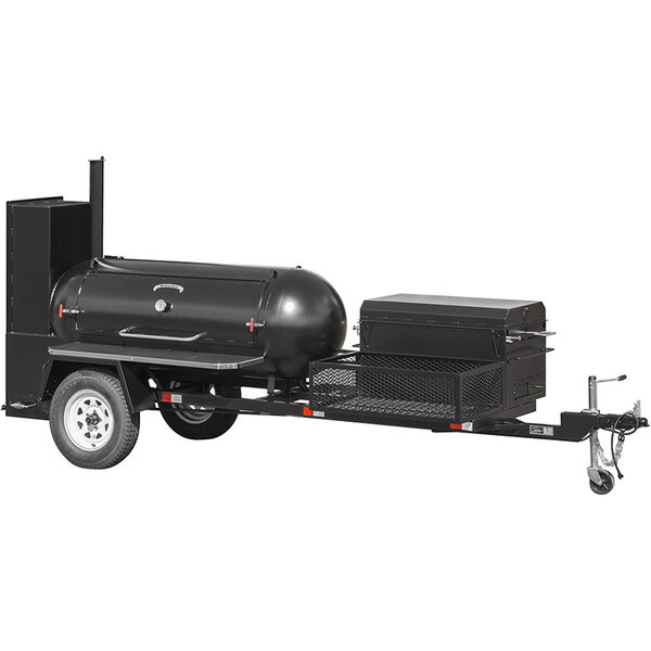 A black Meadow Creek barbecue trailer with a large black smoker barrel.