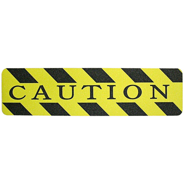 A yellow and black sign with black stripes that says "Caution" in black letters.