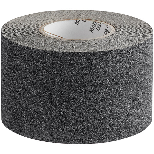 A roll of black Wooster anti-slip tape with a grey abrasive surface.