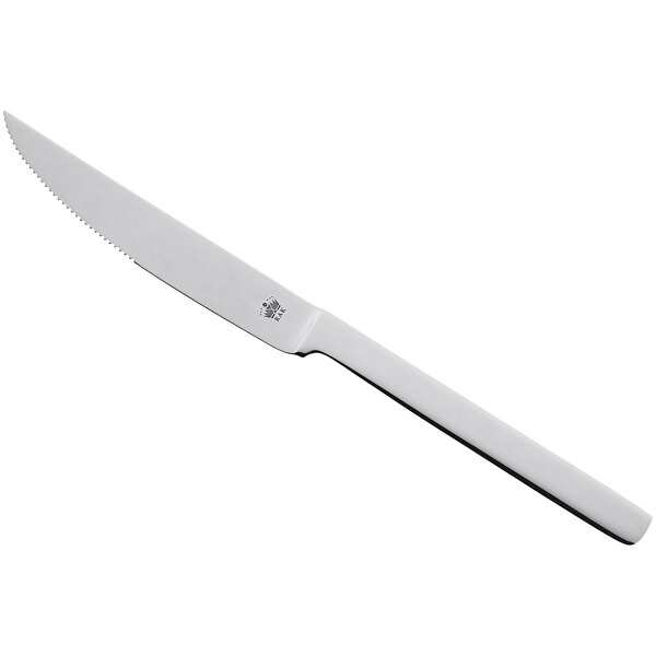 A RAK Porcelain steak knife with a white handle.