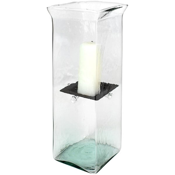 A Kalalou large glass square hurricane candle holder with a white candle inside.