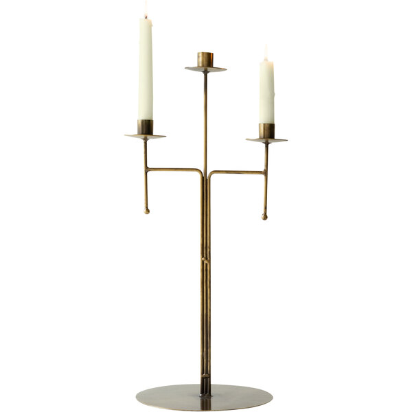A Kalalou 3-tier antique brass taper candelabra with candles on it.