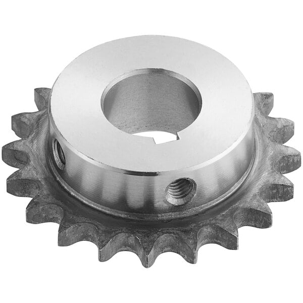 A silver metal sprocket gear with a hole.