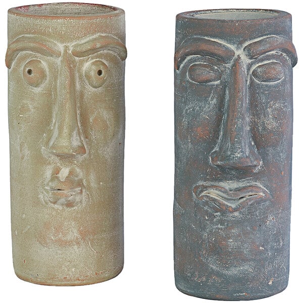 A pair of Kalalou ceramic vases with faces on them.