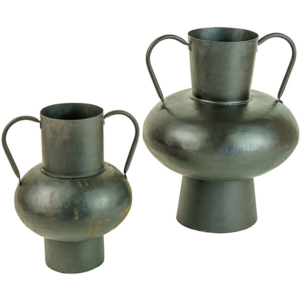 A pair of black metal urns with handles.