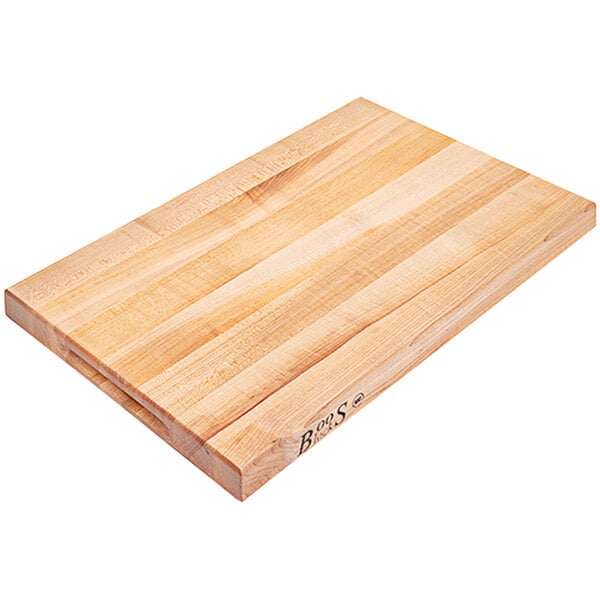 A John Boos maple wood cutting board with finger grips on a white background.