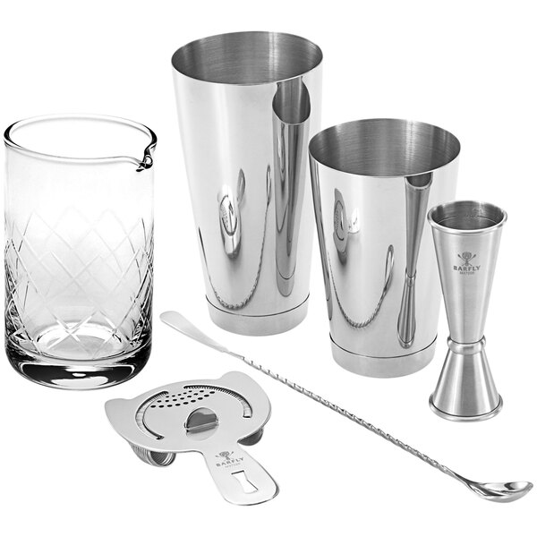 A Barfly stainless steel cocktail mixing kit on a silver table.