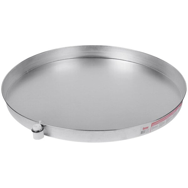 An aluminum round tray with handles.