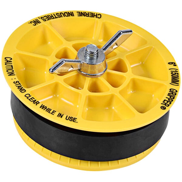 A yellow plastic disc with a black handle and metal nut.