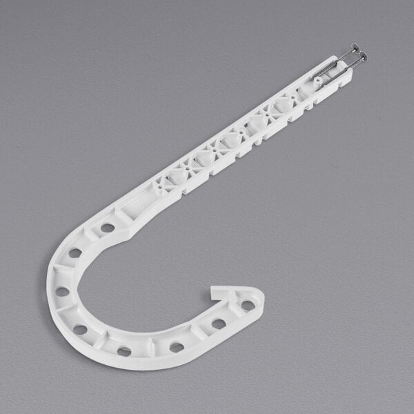 A white plastic Oatey DWV J-Hook with holes.
