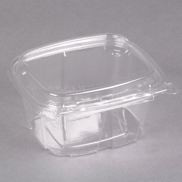 A clear plastic Dart deli container with a dome lid.
