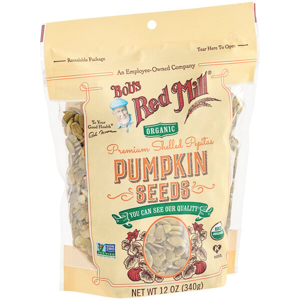 A white bag of Bob's Red Mill Raw Organic Pumpkin Seeds.