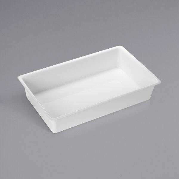 A white rectangular American Metalcraft melamine bowl on a gray surface.