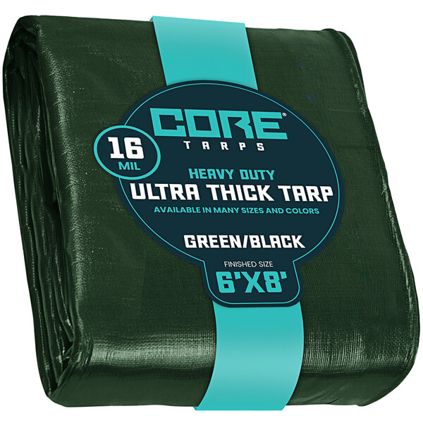 A green tarp with reinforced edges and a blue label.